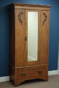 Early 20th century oak wardrobe, single bevelled mirror glazed door, with drawer to base, W99cm,