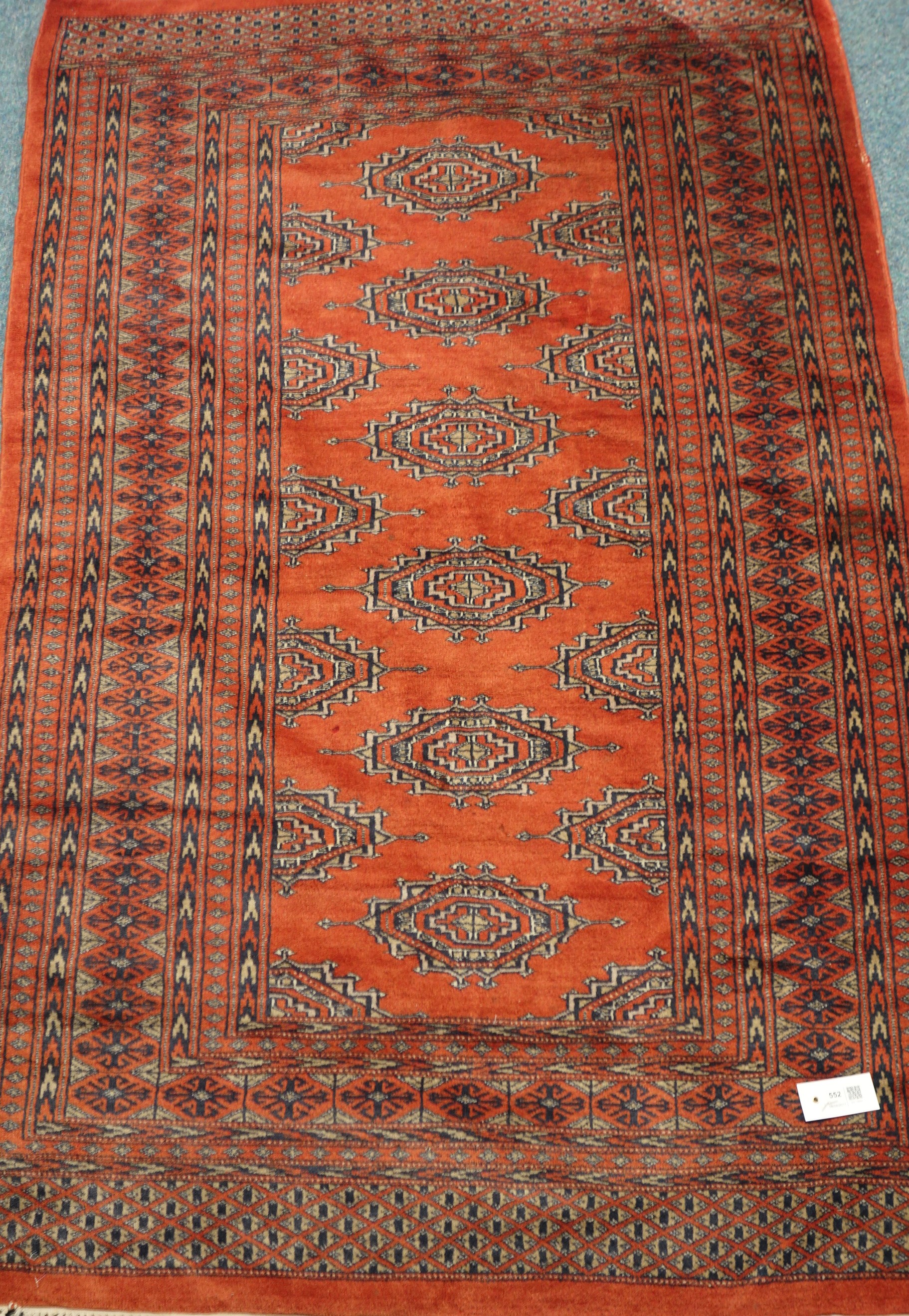 Fine silk and wool rust ground Persian Bokhara rug,