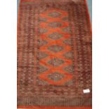 Fine silk and wool rust ground Persian Bokhara rug,