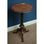 Victorian carved walnut circular tripod wine table, D46cm,