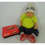 Nel De Man realistic baby doll, with designer clothes and shoes,