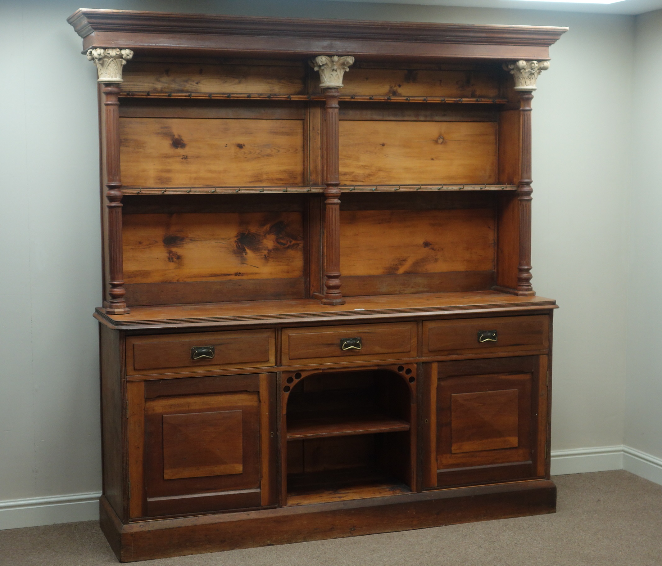 Large late 19th century walnut and pine dresser with plate rack,