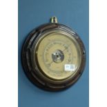 Dollond London aneroid barometer in carved oak case,