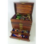 Wooden jewellery chest with brass inlay and costume jewellery,
