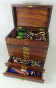 Wooden jewellery chest with brass inlay and costume jewellery,