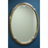 Silvered oval framed wall mirror, bevelled glass,