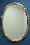Silvered oval framed wall mirror, bevelled glass,