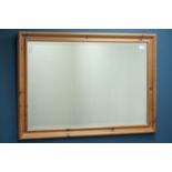Pine framed wall mirror, bevelled glass,