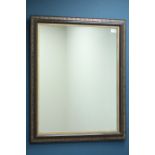 Rectangular wall mirror in brown and gilt frame,