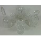 Two cut crystal decanters, candle holder,