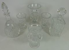 Two cut crystal decanters, candle holder,