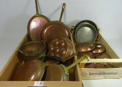 Ten graduating copper pans,