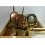 Ten graduating copper pans,