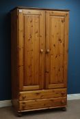 Ducal polished pine double wardrobe with two drawers to base, W96cm, H185cm,
