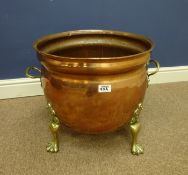 19th/ early 20th Century Copper cauldron with brass paw feet, H41.