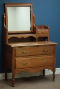 Edwardian walnut two drawer dressing chest, raised off centre swing mirror with trinket drawer,