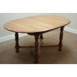 Ercol golden dawn finish elm extending dining table with foldout leaf,