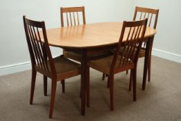 Set four Danish style teak dining chairs with rush seats and a 'Meredew' teak extending dining