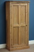 Waxed pine cupboard enclosed by single panelled door, two shelves to interior, W66cm, H143cm,