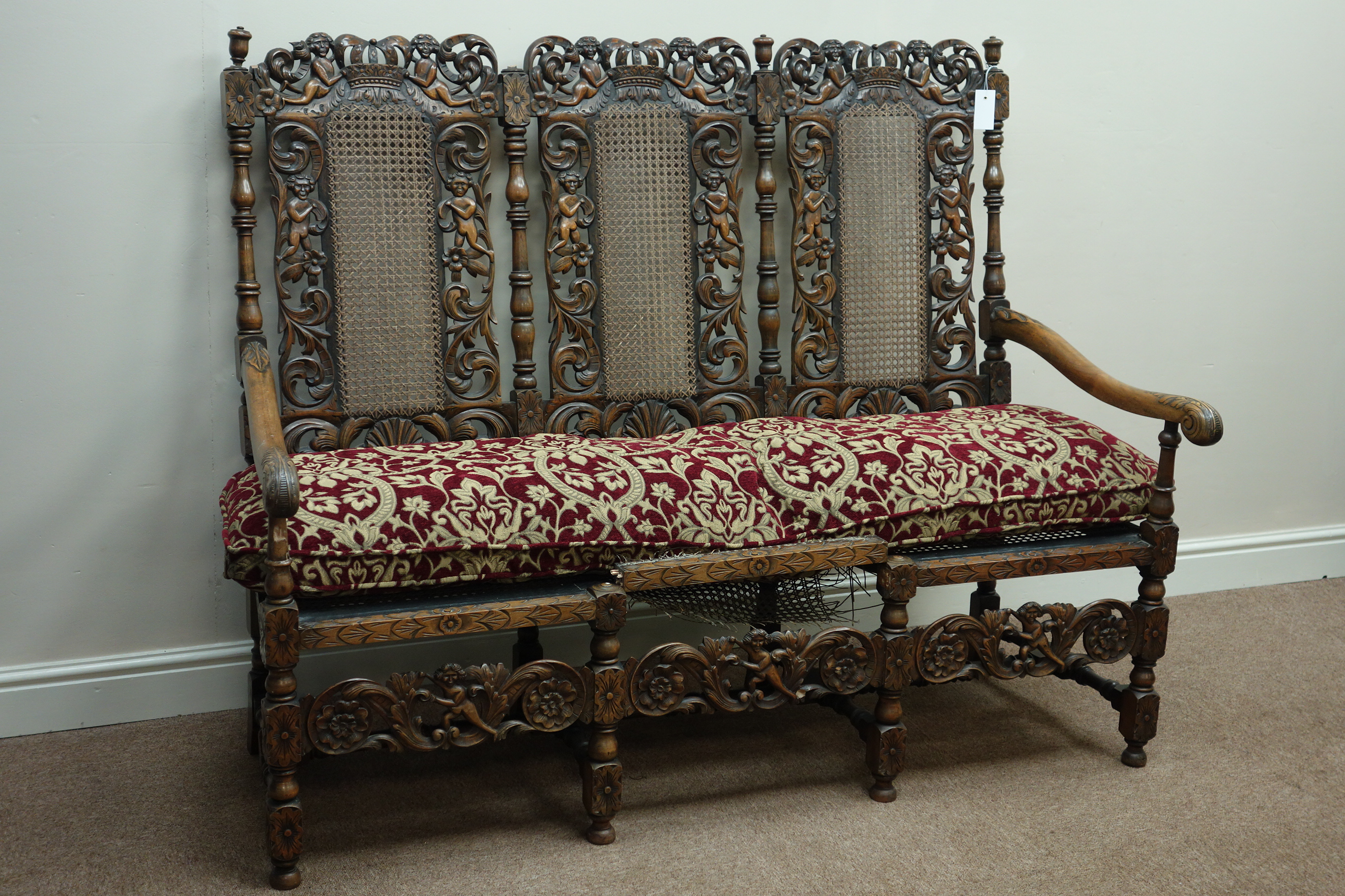 Early 20th century heavily carved Carolean style three seat settee settle,