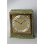 Elliot onyx mantle clock, engraved gilt metal dial with silvered chapter ring,