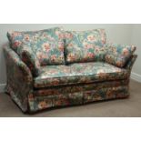 Two seat metal action sofa bed, upholstered in floral fabric,