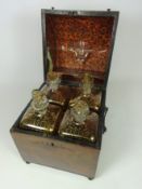 Early 19th Century four bottle figured mahogany Tantalus box,