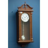 Hermle walnut cased wall hanging clock, chiming movement,