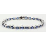 Oval sapphire and diamond bracelet stamped 18k Condition Report <a href='//www.