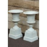 Pair Victorian style white finish Campana urns with egg and dart rim on plinths, W35cm,