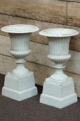 Pair Victorian style white finish Campana urns with egg and dart rim on plinths, W35cm,
