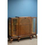 Mid 20th century figured walnut cocktail cabinet, hinged fall front with mirrored interior,