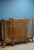 Mid 20th century figured walnut cocktail cabinet, hinged fall front with mirrored interior,