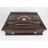 Early 20th Century Mahogany desk stand with inkwells and a early 20th Century white metal quill