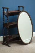 Oval oak framed wall mirror with bevelled glass and a barley twist three tier book case