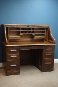 Early 20th century 'Angus London' tambour roll top twin pedestal desk, seven drawers,