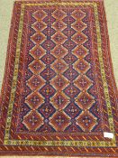 Persian red and blue ground rug, repeating pattern,