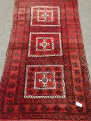 Afghan red ground rug, triple square medallion,