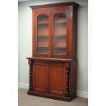 Victorian mahogany bookcase on cupboard, raised glazed doors, W113cm, H206cm,