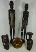 Pair of tall floor standing African carved wood male and female figures,