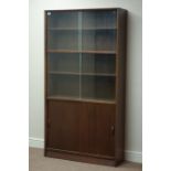 Three mid 20th century Autographed Furniture 'Herbert E Gibbs' bookcases with sliding doors, W92cm,