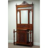 Reproduction carved mahogany hall stand, cupboard and single drawer, with bevelled mirror back,