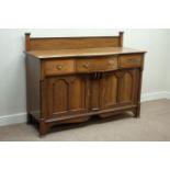 Early 20th century oak bow break front sideboard, three drawers,