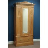 Edwardian satin walnut single wardrobe, single bevelled mirror glazed door, and drawer to base,