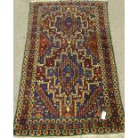 Persian Shiraz blue ground rug, green elements,