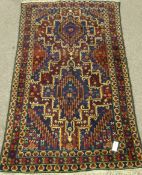 Persian Shiraz blue ground rug, green elements,