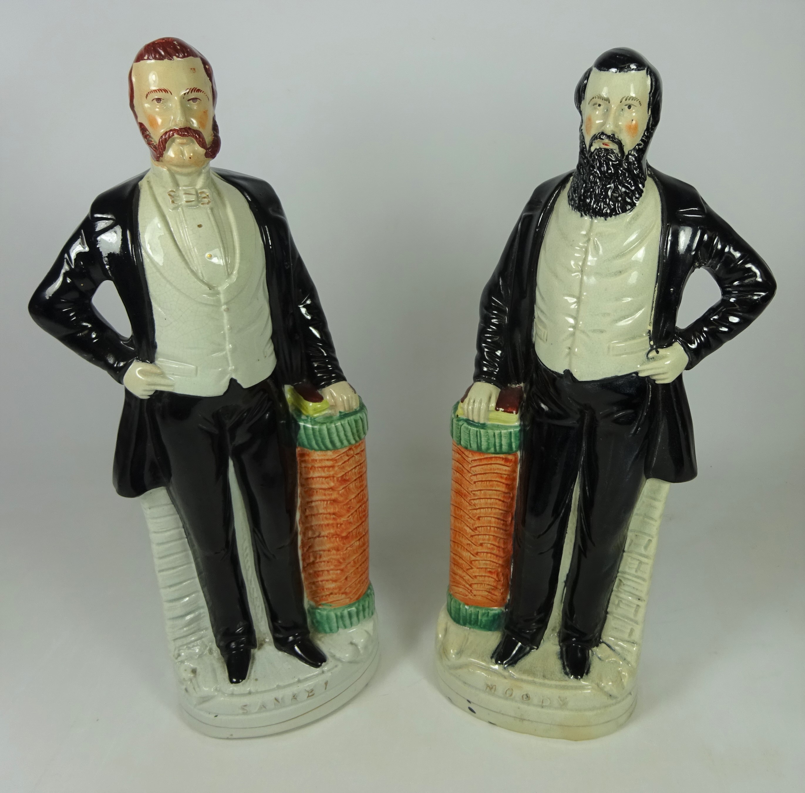 Pair of 19th Century Staffordshire figures of Ira Sankey and Dwight Moody,