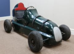 A mid-20th century Austin Pathfinder pedal car with pressed steel body in dark green racing livery,