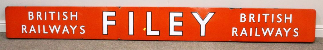 Rare 'Filey' enamel Railway Station long sign, white letters with black outline on a red ground,