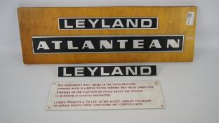 Two Leyland and Atlantean alloy badges & a Bus passenger warning sign (4) Condition